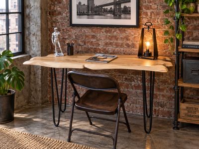 Living Edge Desk with natural pale wood top, irregular flowing edges and slender black metal hairpin legs.