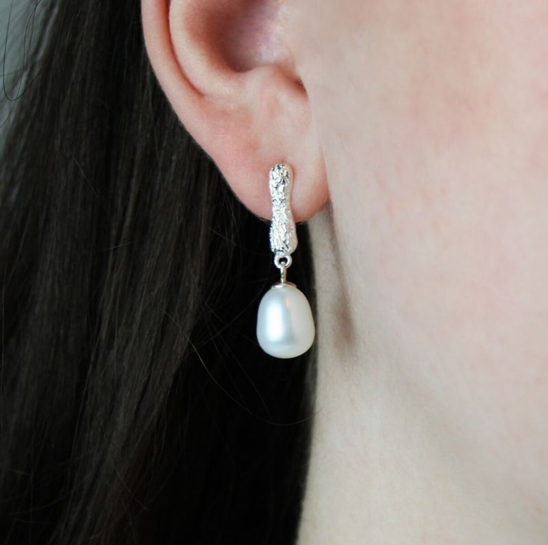 Aflange mønstret perleøreringe