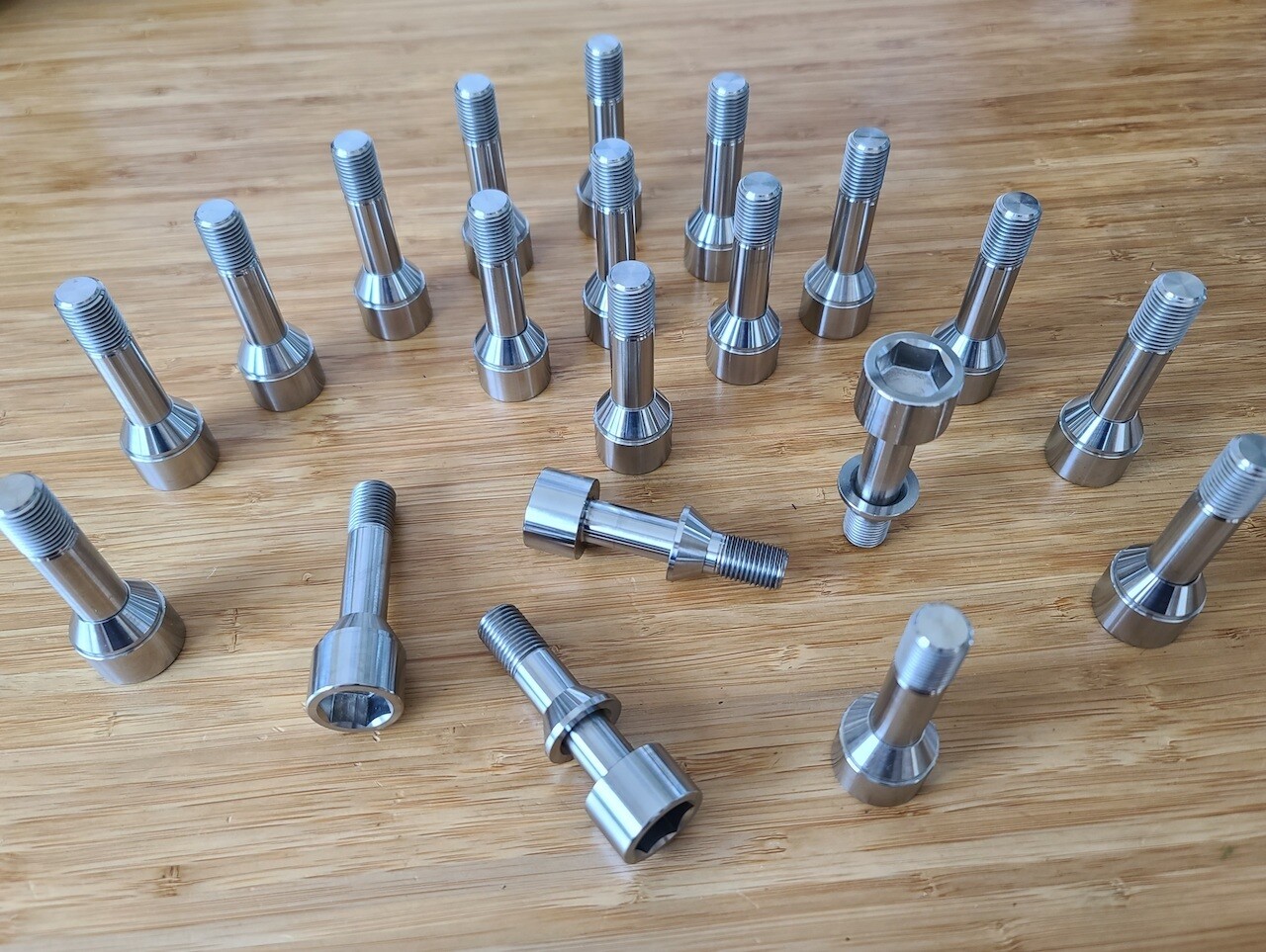 Ferrari Titanium wheel lug bolts - Challenge style - Updated floating washer design - Polished - Also fits Maserati