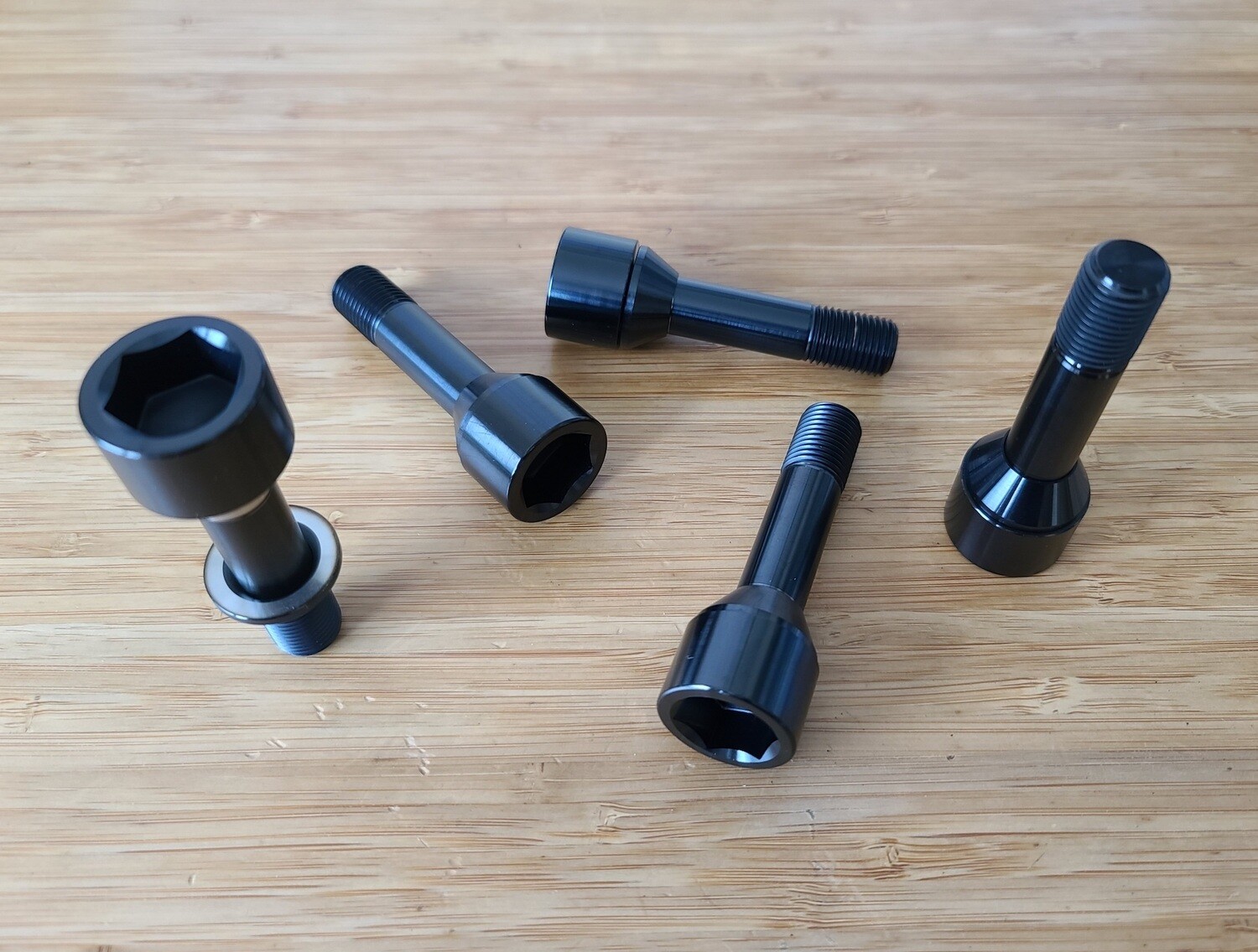 Ferrari Titanium wheel lug bolts - Challenge style - Updated floating washer design - Black - Also fits Maserati