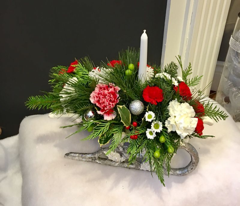 Christmas Sleigh Arrangement with a tapered candle
