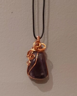 Wire-wrapped amethyst crystal pendant