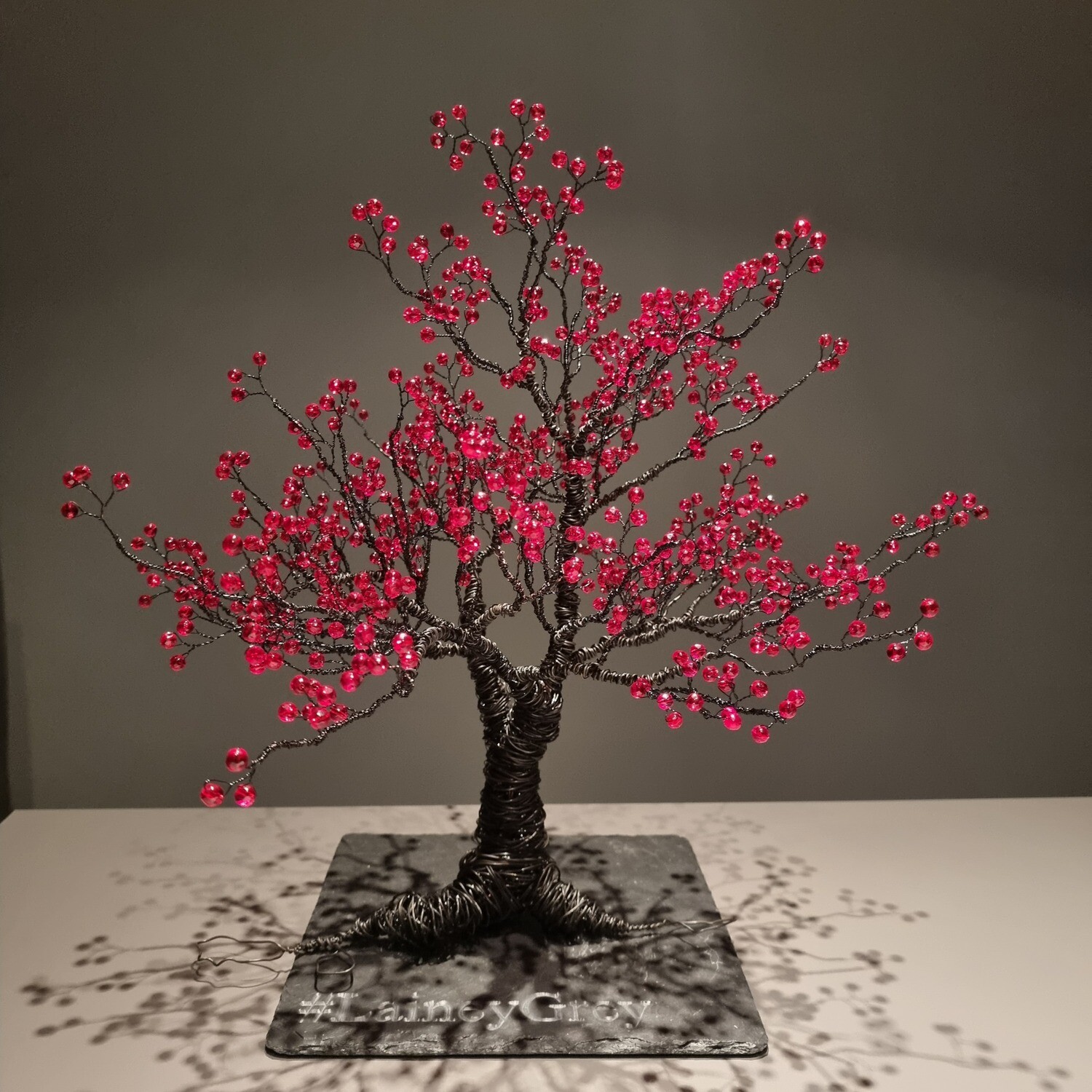 Black tree with red glass beads