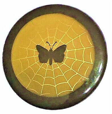AN EXTRA LARGE CELLULOID BUTTON
