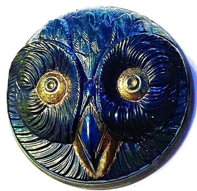 BLACK OR CLEAR AND COLORED GLASS OWL IN METAL?