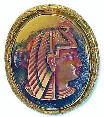 A LARGE SIZE MOLDED CARMEL GLASS EGYPTIAN HEAD SET IN METAL