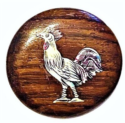 AN INLAID WOOD BUTTON FROM THE MOTIWALA STUDIOS