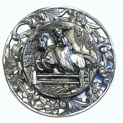 A LARGE SILVERED BRASS HORSE AND RIDER BUTTON
