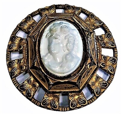 A LARGE SIZE GLASS HEAD IN A BRASS MOUNTING