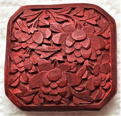 AN EXTRA LARGE DIV 1 CARVED CINNABAR SQUARE BUTTON