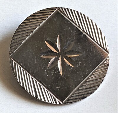 AN EARLY 19TH CENTURY ENGRAVED STEEL BUTTON