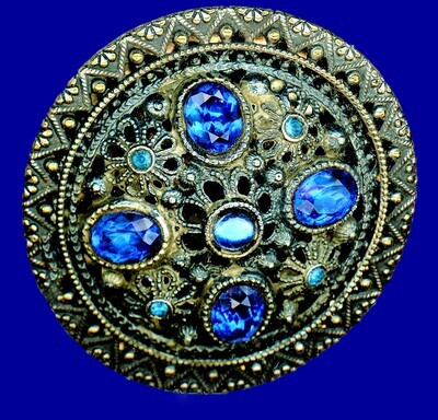 A LARGE BLUE JEWEL GAY 90 STYLE BUTTON