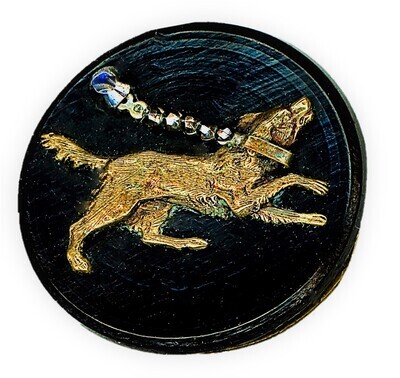 A MEDIUM 19TH CENTURY BRASS AND STEEL OVER WOOD DOG BUTTON