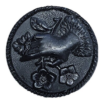 A LARGE HIGH RELIEF BLACK GLASS HAND BUTTON