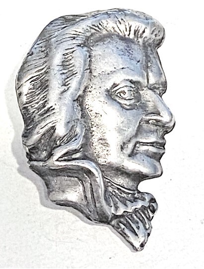 A VERY UNUSUAL LARGE REALISTIC SILVER BUTTON