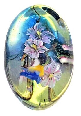 A LARGE COLORFUL PAPERWEIGHT BUTTON BY MARY GAUMOND