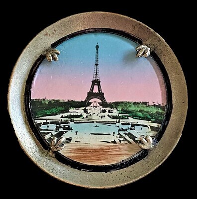 AN EXTRA LARGE REVERSE PAINTED GLASS IN METAL EIFEL TOWER BUTTON