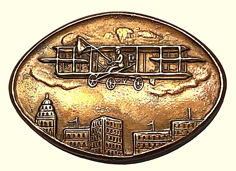 A SCARCE "WRIGHT BROTHERS" STYLE AIRPLANE PICTORIAL BUTTON