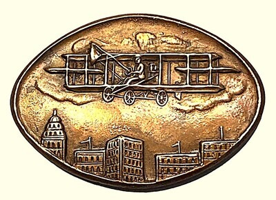 A SCARCE &quot;WRIGHT BROTHERS&quot; STYLE AIRPLANE PICTORIAL BUTTON