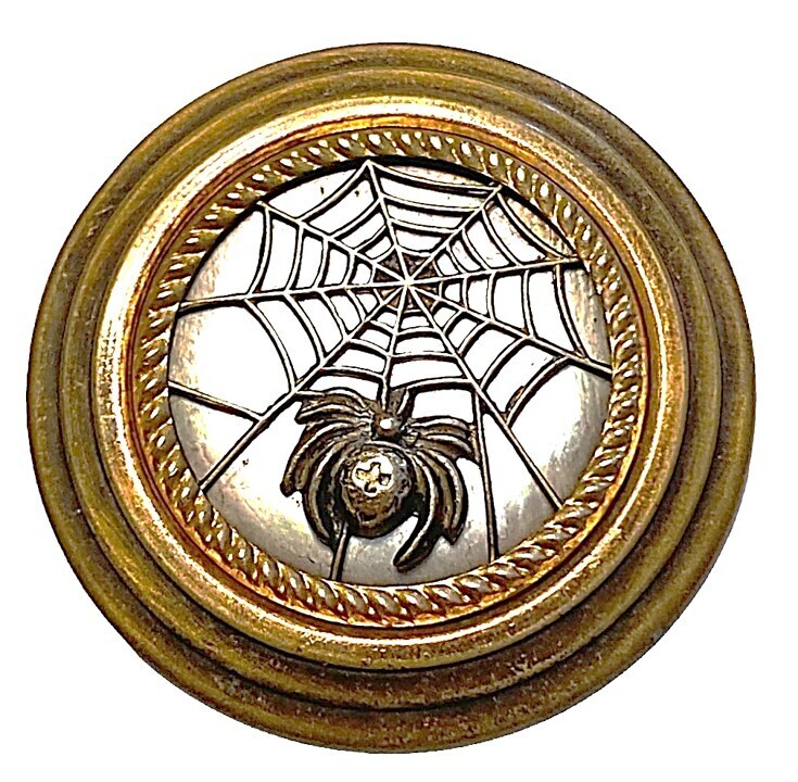 A LARGE 19TH CENTYRT PEARL BACKGROUND SPIDER BUTTON
