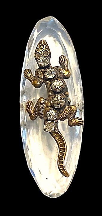 A RARE DIVISION ONE CRYSTAL AND BRASS LIZARD BUTTON.