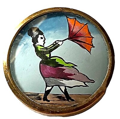 Another unusual hand painted under glass button!