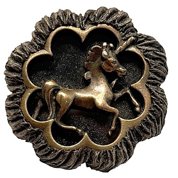 A SCARCE BAKELITE AND BRASS UNICORN BUTTON!