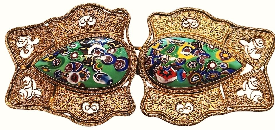 1 two piece early 20th century glass in metal pierced buckle.