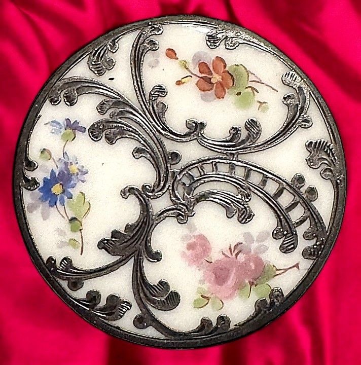 A scarce extra-large silver overlay porcelain button.
