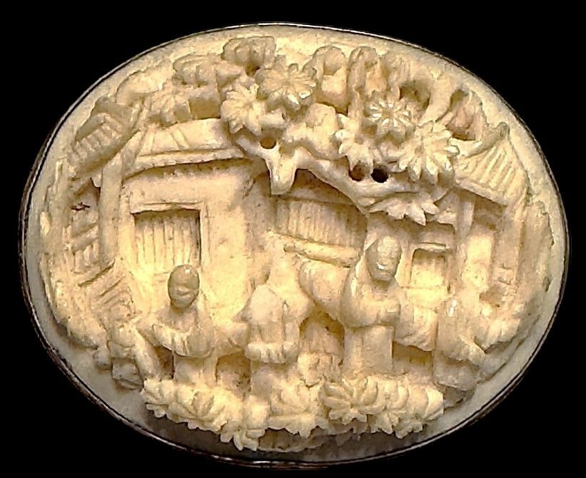 A very rare deeply hand carved 19th century natural material button from Canton China!