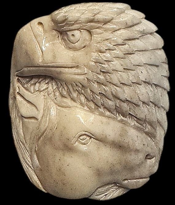 A stunning carved Eagle and Horse Head button!