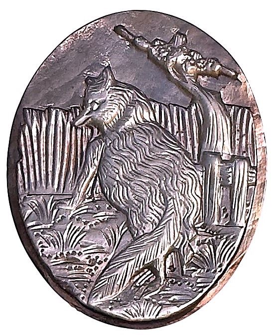 A wonderful hand carved OVAL pearl of a fox scene!
