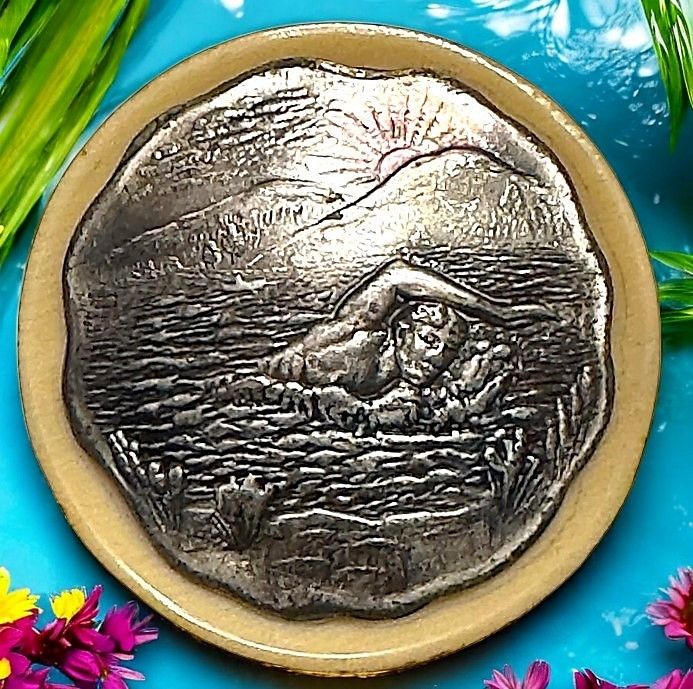A Rare celluloid SWIMMER button.