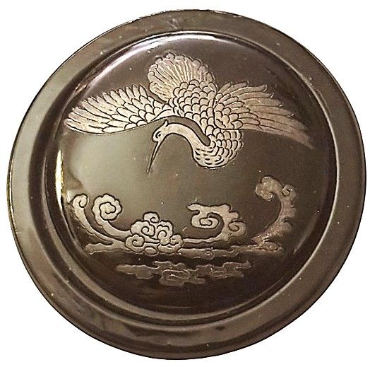 An extra large silver lustered flying bird on black glass in metal!
