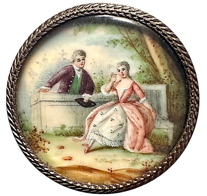 A wonderful hand painted pastoral scene under glass button!