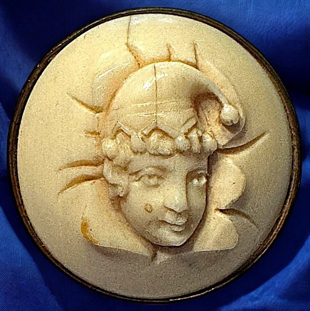 A wonderful large carved natural material mounted in metal button!