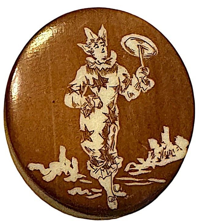 A medium size natural material wax resist button!