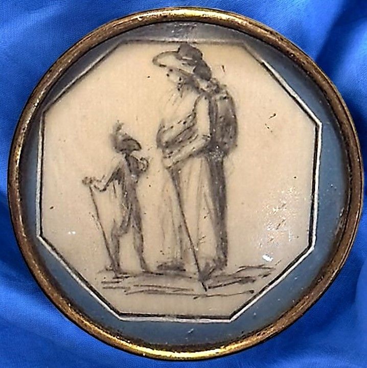 A charming hand painted natural material under glass button!