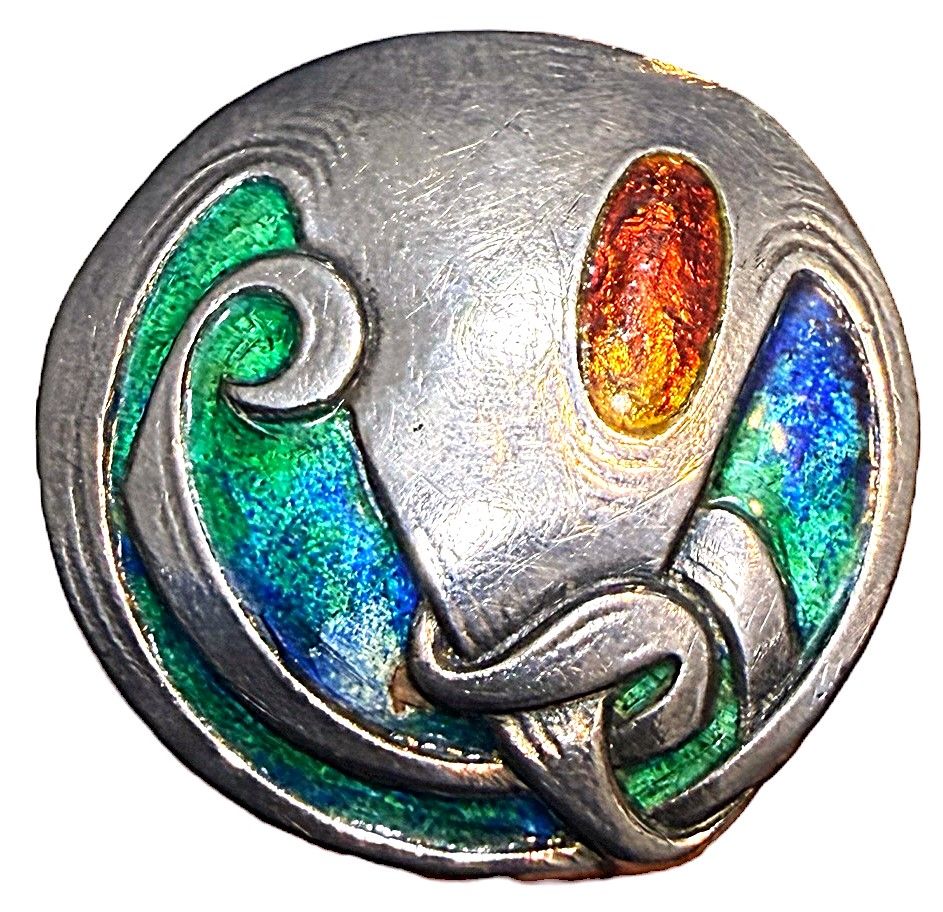 A large Arts and Crafts Cymeric enamel and silver button