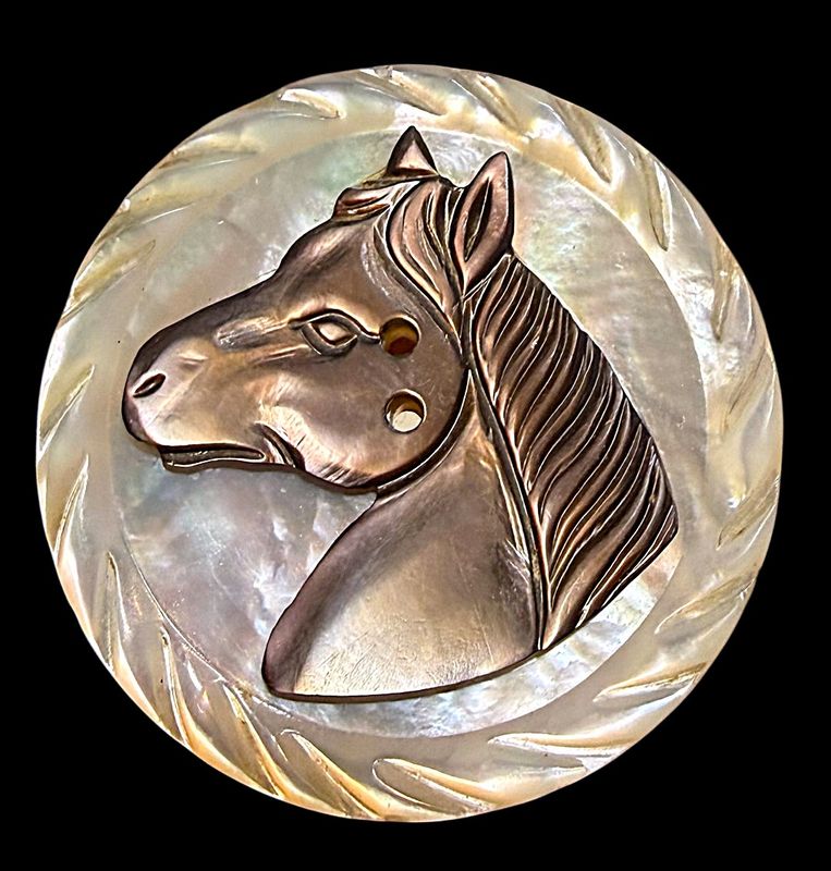 A large division one sew thru pearl Horse button!