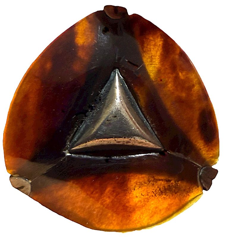 A beautiful medium tortoise shell triangular shaped Mexican silver button.