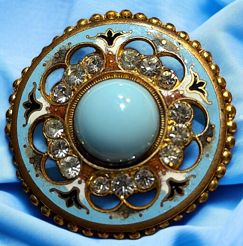A beautiful turquoise colored glass and enamel paste jeweled button