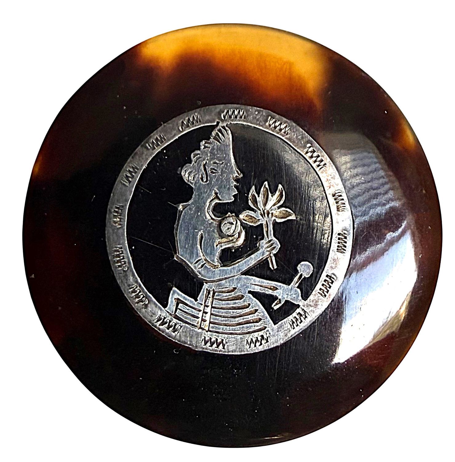 A RARE large genuine Tortoise shell button with and inlayed silver pictorial design.