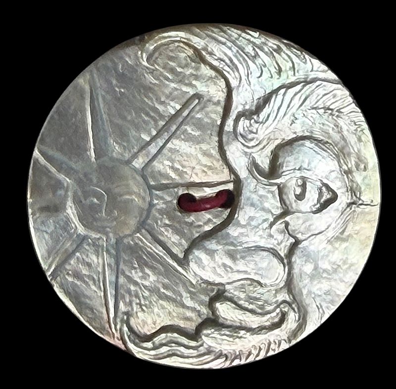 A klarge size detailed carved pearl button by Herman Bangemann!