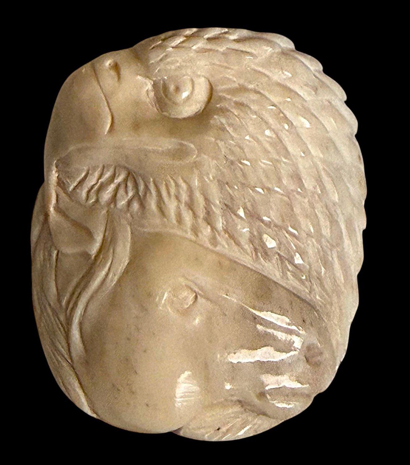 A very cool carved Horse and Eagle head button!