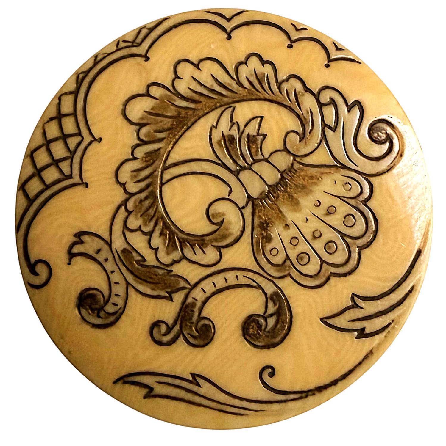 A BEAUTIFUL ENGRAVED IVORINE BUTTON