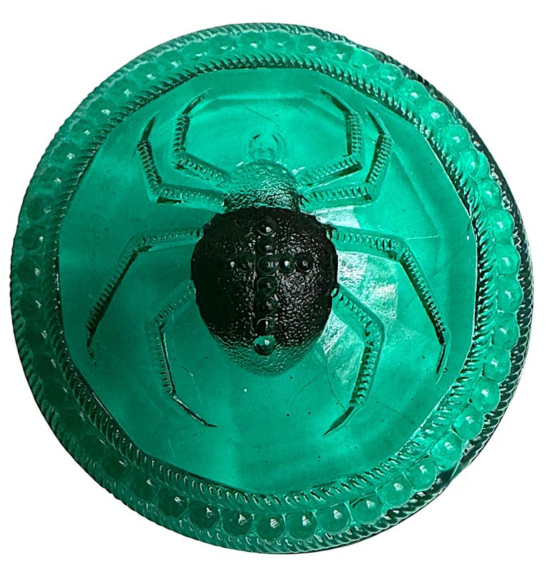 A LARGE GREEN GLASS SPIDER BUTTON