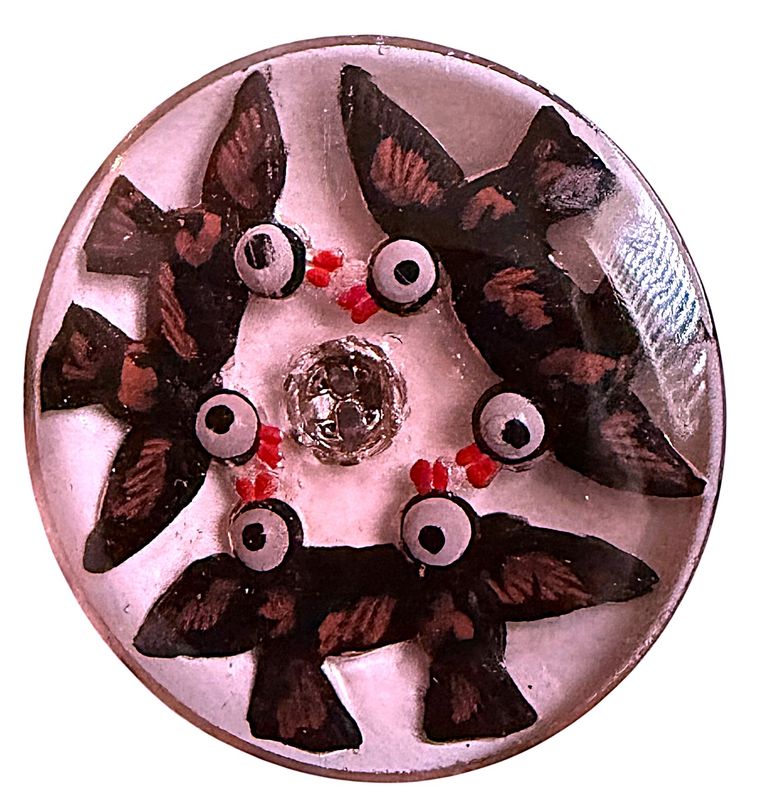 A VERY COOL LARGE REVERSE INTAGLIO BIRD BTTON