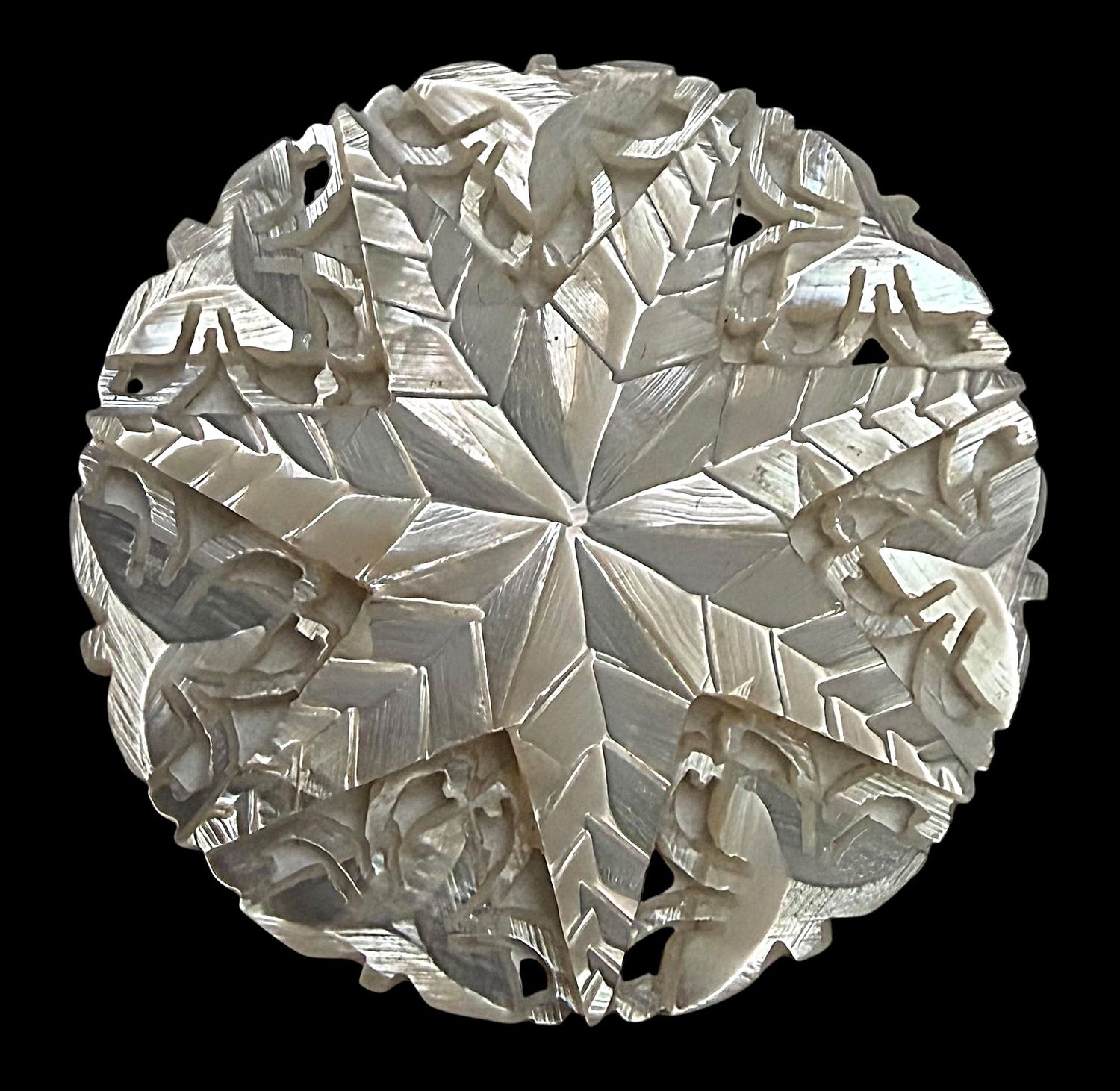 A LARGE 1930'S PIERCED CARVED BETHLEHAM PEARL BUTTON