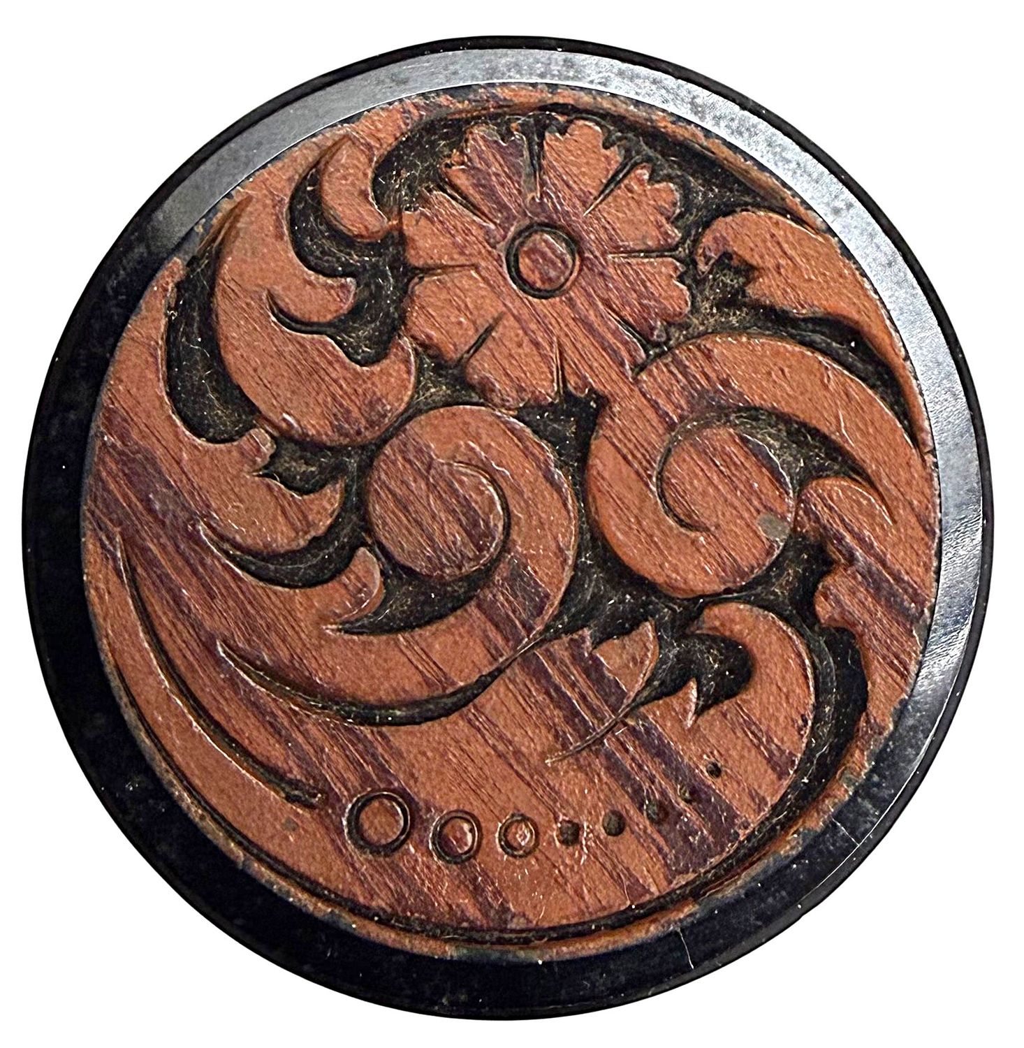 A large division one faux wood black glass button